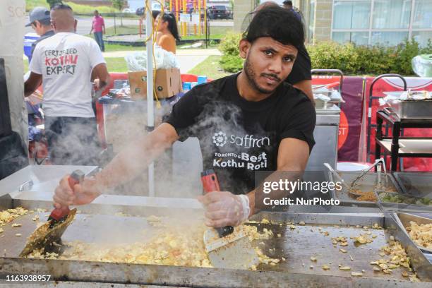 Cook prepares kothu roti during the Tamil Street Festival in Markham, Ontario, Canada, on August 24, 2019.