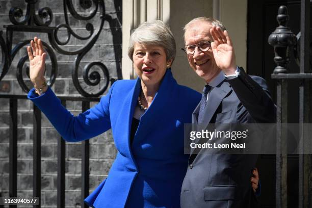 British Prime Minister Theresa May and husband Philip stand on the doorstep for the final time after she made her final address to the public on...