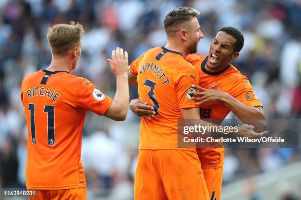 Isaac Hayden of Newcastle celebrates their win with Matt Ritchie and Paul Dummett during the Premier League match between Tottenham Hotspur and...