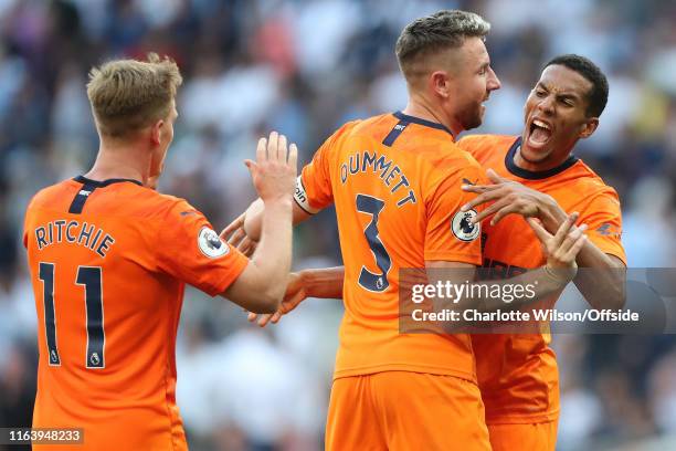 Isaac Hayden of Newcastle celebrates their win with Matt Ritchie and Paul Dummett during the Premier League match between Tottenham Hotspur and...