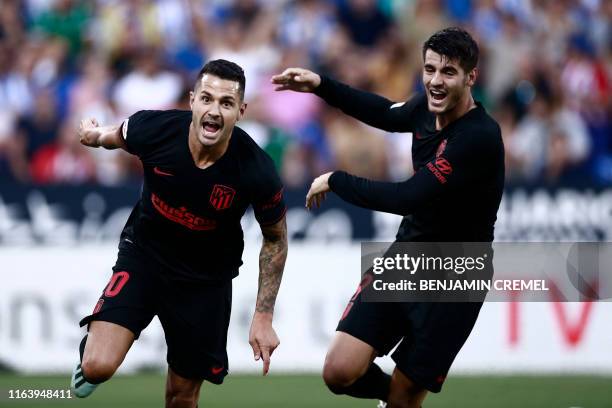 Atletico Madrid's Spanish midfielder Vitolo celebrates with Atletico Madrid's Spanish forward Alvaro Morata after scoring a goal during the Spanish...