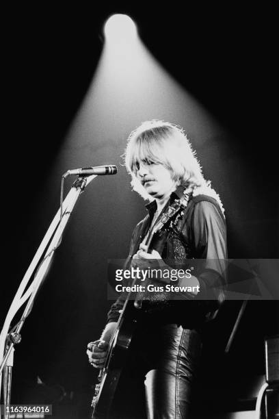 British rock music vocalist, songwriter, guitarist and keyboard player John Miles performs on stage, circa 1975.