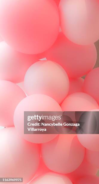 a bunch of pink balloons - birthday balloons photos et images de collection