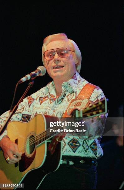 American country singer and musician George Jones performs live on stage at Hammersmith Apollo in London in September 1995.