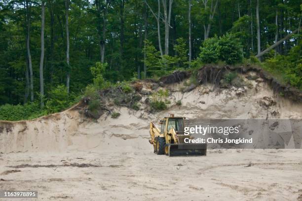 backhoe moving sand - ontario canada stock pictures, royalty-free photos & images