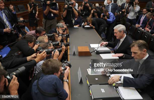 Former Special Counsel Robert Mueller and former Deputy Special Counsel Aaron Zebley arrive to testify before the House Intelligence Committee about...