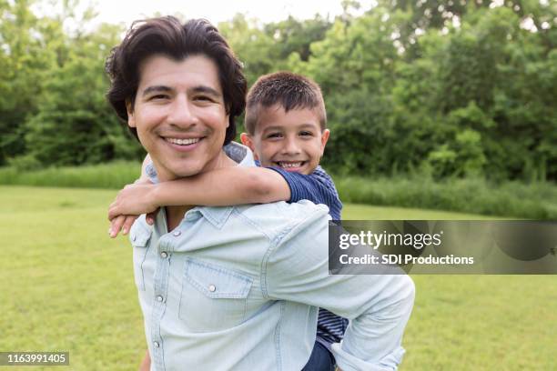 portrait of happy father and son - uncle stock pictures, royalty-free photos & images