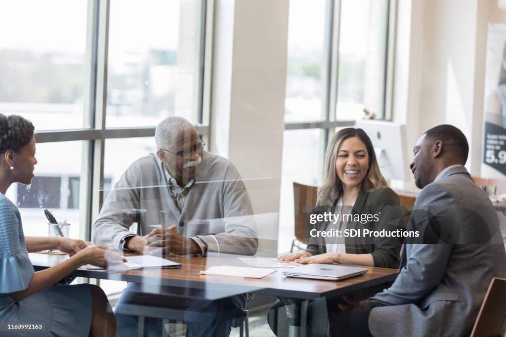 Multi-ethnic group of business owners meet to discuss business issues