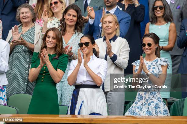 July 13: Catherine, Duchess of Cambridge and Meghan, Duchess of Sussex and Pippa Middleton in the Royal Box on Centre Court applaud the winner Simona...
