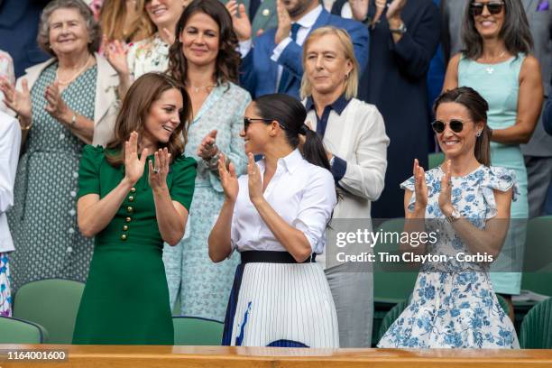 July 13: Catherine, Duchess of Cambridge and Meghan, Duchess of Sussex and Pippa Middleton in the Royal Box on Centre Court applaud the winner Simona...