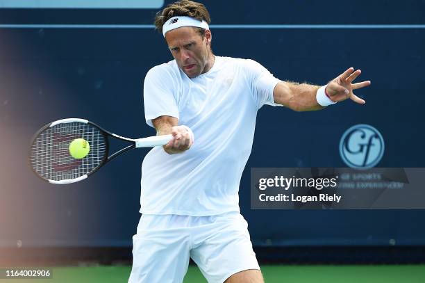Robert Lindstedt of Sweden returns a forehand to Jonathan Erlich of Israel and Divij Sharan of India during the BB&T Atlanta Open at Atlantic Station...