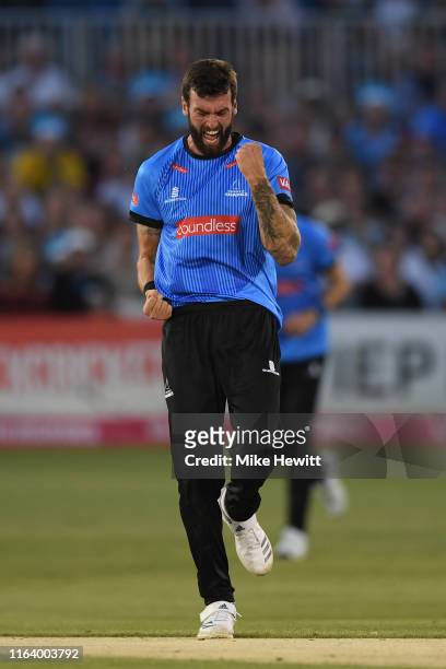 Reece Topley of Sussex celebrates after dismissing Aneurin Donald of Hampshire during the Vitality Blast match between Sussex Sharks and Hampshire at...