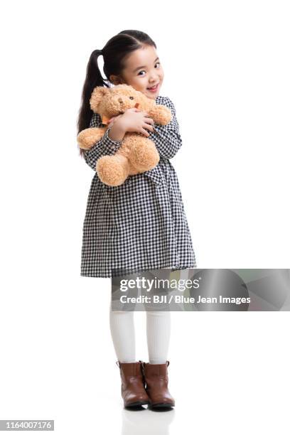 happy little chinese girl with teddy bear - girl who stands stock pictures, royalty-free photos & images