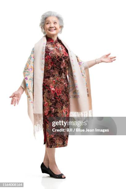 happy senior chinese woman in qipao - the cheongsam stock-fotos und bilder