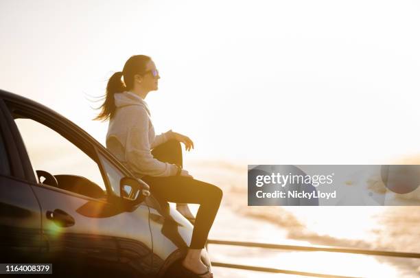 taking time to relax at the beach - sitting on beach stock pictures, royalty-free photos & images