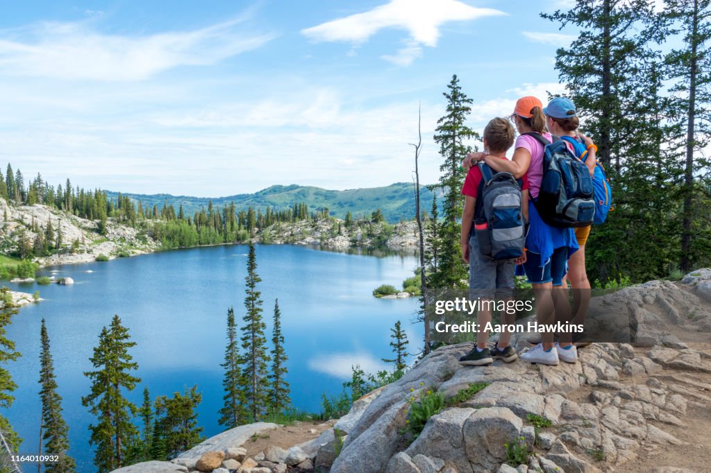 Family Admiring a Panoramic Scene Above a Mountain Lake - Lake Mary in the Wasatch Mountains of Utah