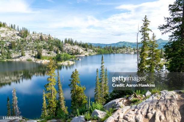 panoramic scene above a mountain lake - lake mary in the wasatch mountains of utah - mountain peak utah stock pictures, royalty-free photos & images