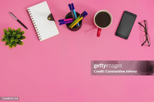 office supply items on pink background - desk organizer stock pictures, royalty-free photos & images