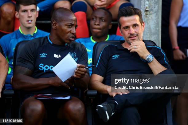 Everton manager Marco Silva looks on next to assistant manager Luis Boa Morte during the Pre-Season Friendly match between Wigan Athletic and Everton...