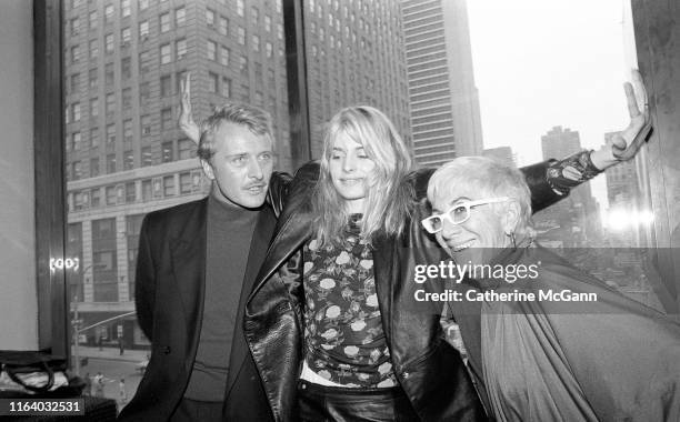 To R: Actors Rutger Hauer and Nastassja Kinski pose with director Lina Wertmuller at a press conference for Wertmullers' film "Crystal or Ash, Fire...