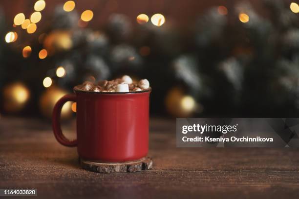 winter whipped cream hot coffee in a red mug with star shaped cookies and warm scarf - rural still life - coffee christmas ストックフォトと画像