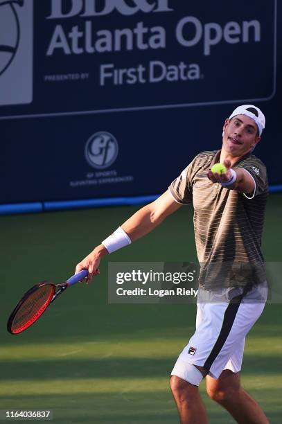 John Isner serves to Reilly Opelka during the BB&T Atlanta Open at Atlantic Station on July 24, 2019 in Atlanta, Georgia.