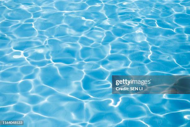 rippled water in the swimming pool - water surface pool stock pictures, royalty-free photos & images