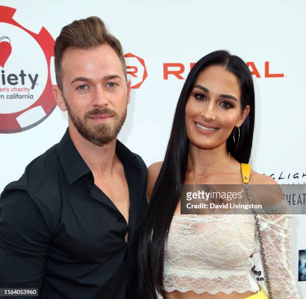 Artem Chigvintsev and Nikki Bella attends the 9th Annual Variety - The Children's Charity Poker and Casino Night at Paramount Studios on July 24,...