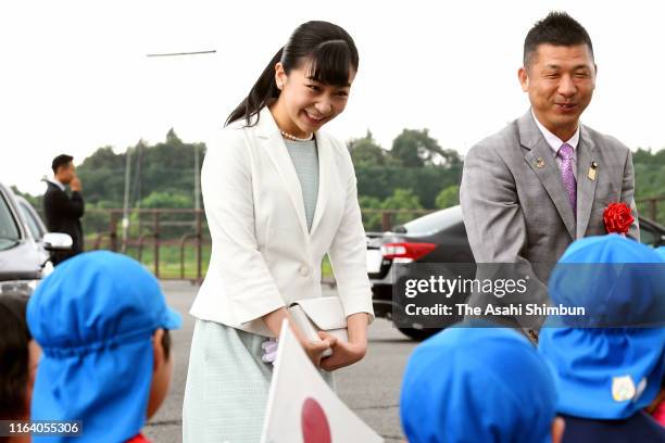 Princess Kako of Akishino talks with kindergarten children on arrival at the Japan High School Equestrian Championships on July 24, 2019 in Gotemba,...