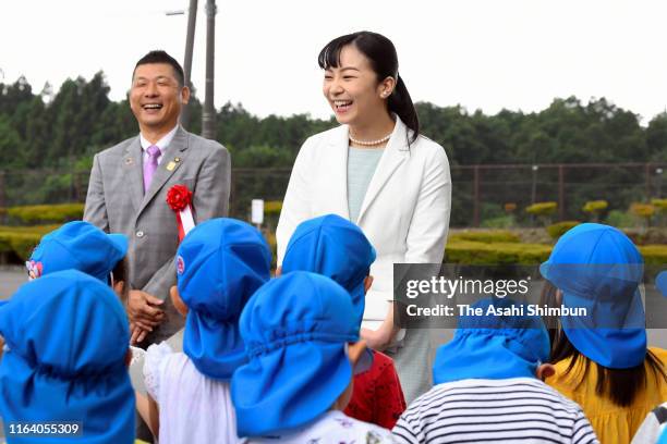 Princess Kako of Akishino talks with kindergarten children on arrival at the Japan High School Equestrian Championships on July 24, 2019 in Gotemba,...