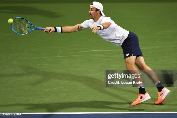 Jordan Thompson of Australia returns a forehand to Jack Sock and Jackson Withrow during the BB&T Atlanta Open at Atlantic Station on July 24, 2019 in...