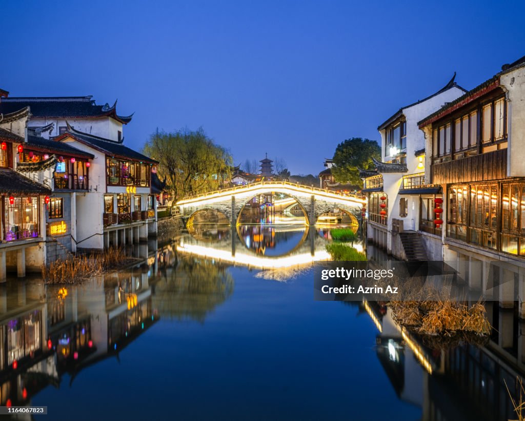 A reflection of Qibao Famous Bridge