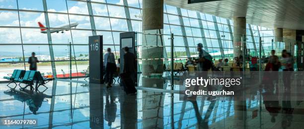 people in the airport. - crowded airplane stock pictures, royalty-free photos & images