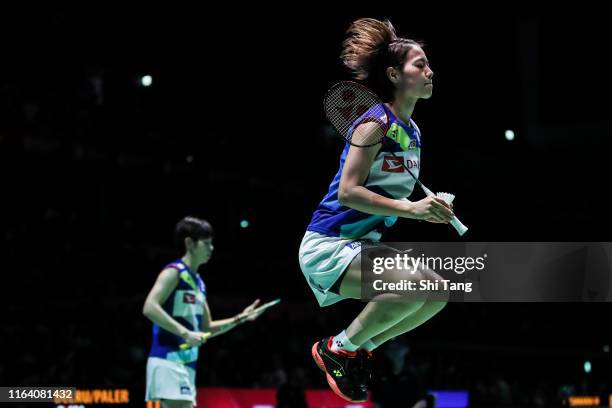 Yuki Fukushima and Sayaka Hirota of Japan compete in the Women's Doubles second round match against Delphine Delrue and Lea Palermo of France during...