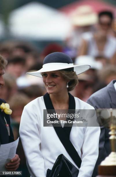 Princess Diana at Flemington race course in Melbourne, Australia, 5th November 1985. She is wearing a suit by Bruce Oldfield and a hat by Frederick...