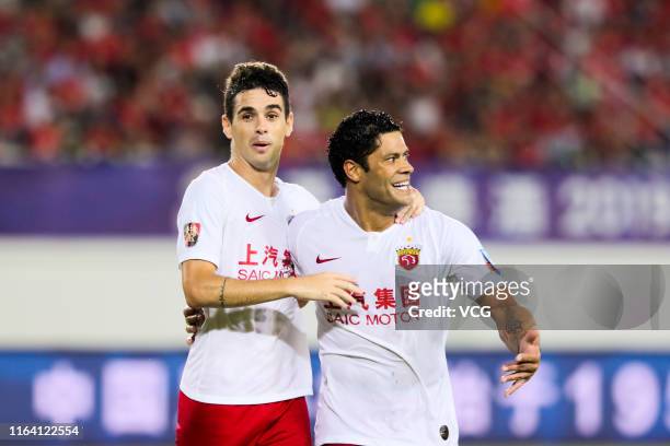 Oscar of Shanghai SIPG celebrates with Hulk after scoring a goal during the 2019 Chinese Football Association Cup quarter-final match between...