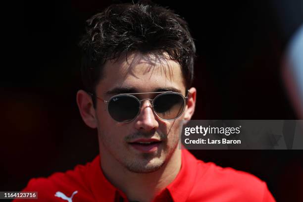 Charles Leclerc of Monaco and Ferrari looks on in the Paddock during previews ahead of the F1 Grand Prix of Germany at Hockenheimring on July 25,...