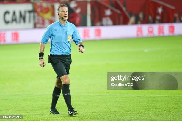 Referee Mark Clattenburg in action during the 2019 Chinese Football Association Cup quarter-final match between Guangzhou Evergrande and Shanghai...