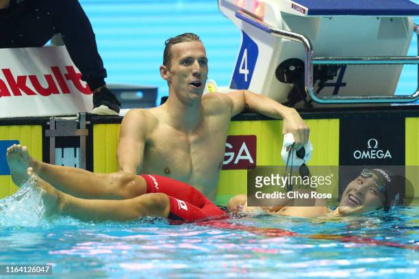 Daiya Seto of Japan and Jeremy Desplanches of Switzerland react after the Men's 200m Individual Medley Final on day five of the Gwangju 2019 FINA...