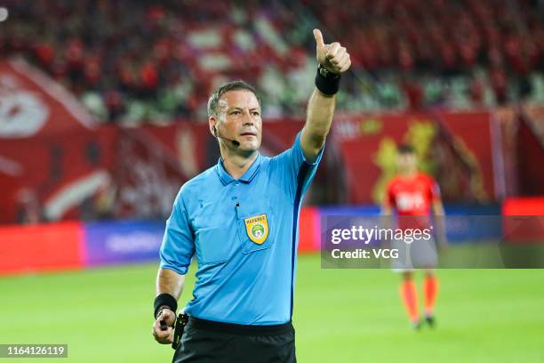 Referee Mark Clattenburg in action during the 2019 Chinese Football Association Cup quarter-final match between Guangzhou Evergrande and Shanghai...