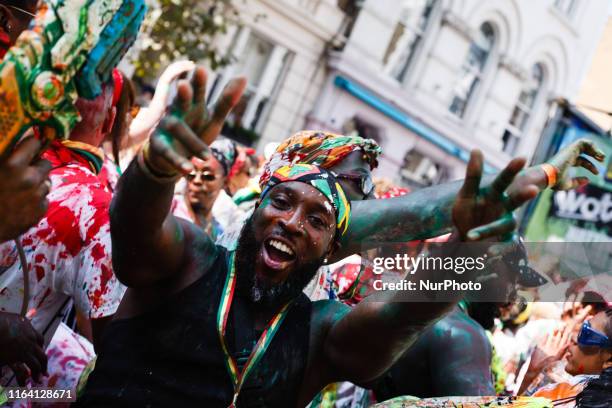 J'ouvert reveller strikes a pose on Ladbroke Grove on the opening day of the 2019 Notting Hill Carnival in London, England, on August 25, 2019. Up to...