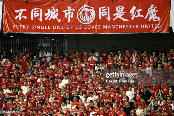 Of Manchester United supporters cheer during the International Champions Cup match between Tottenham Hotspur and Manchester United at the Shanghai...