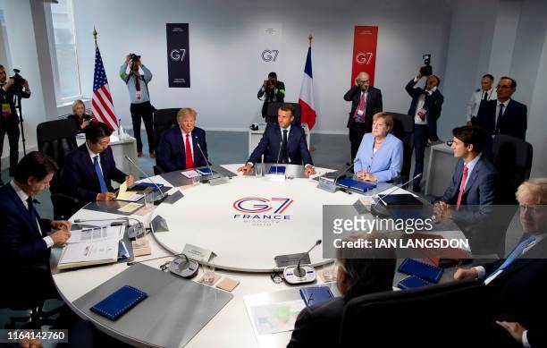Italian Prime Minister Giuseppe Conte, Japanese Prime Minister Shinzo Abe, US President Donald Trump, French President Emmanuel Macron, German...