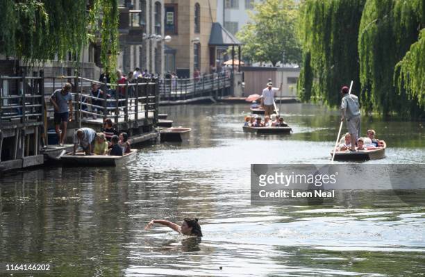 Woman swims in the River Cam on July 25, 2019 in Cambridge, United Kingdom. The Met Office issued a weather warning from 3pm this afternoon. They...