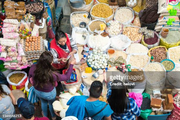 high angle view on farmer's market - vendor selling pulses in local market stock pictures, royalty-free photos & images