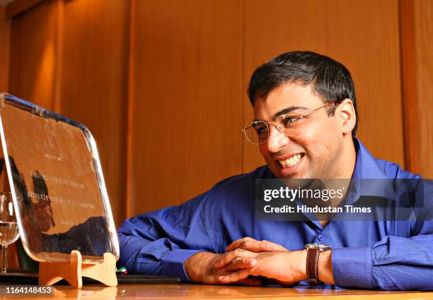 World chess champion Vishwanathan Anand poses with his medal, on October 16, 2007 in New Delhi, India. Anand became the World Chess Champion on Sept....