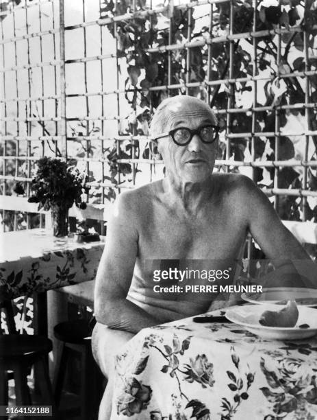 An undated picture of French architect Le Corbusier having a meal at a small restaurant, L'Etoile des mers", next to his "cabanon" , a tiny bolthole...