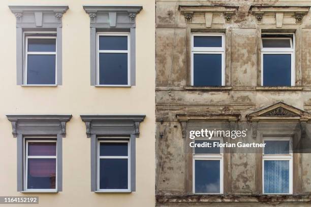 Refurbished and unrefurbished part of a house is pictured on August 19, 2019 in Crimmitschau, Germany.