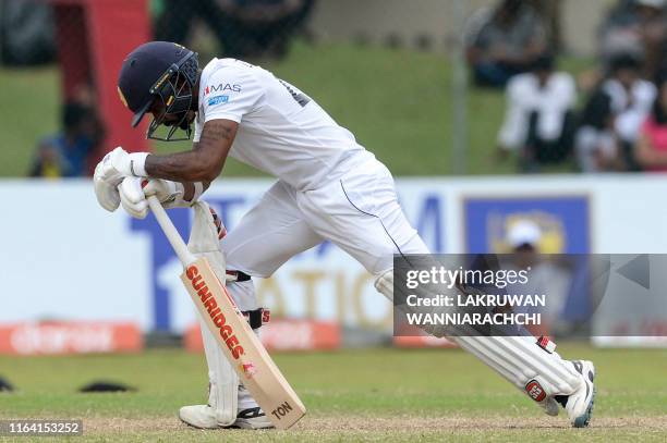 Sri Lanka's cricketer Niroshan Dickwella reacts after being dismissed during the final day of the final cricket Test match between Sri Lanka and New...