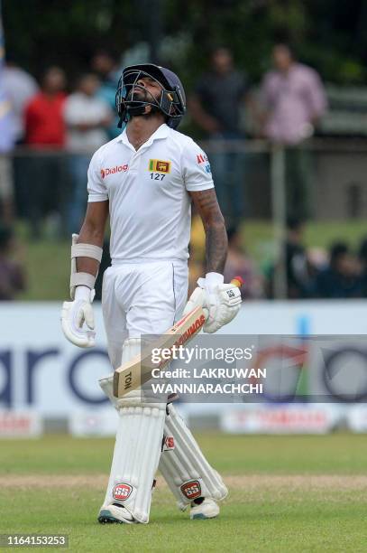 Sri Lanka's cricketer Niroshan Dickwella reacts after being dismissed during the final day of the final cricket Test match between Sri Lanka and New...